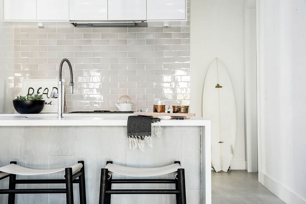 Kitchen-in-white-with-tiled-backdrop-and-a-lovely-island.jpg